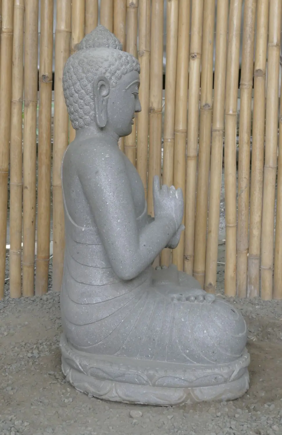  Product image 4 of the product “Seated Buddha made of Riverstone in Dharmachakra gesture of wheel of the teaching of the Dharma, H. 83cm. There is a stone eye on the left shoulder. ”